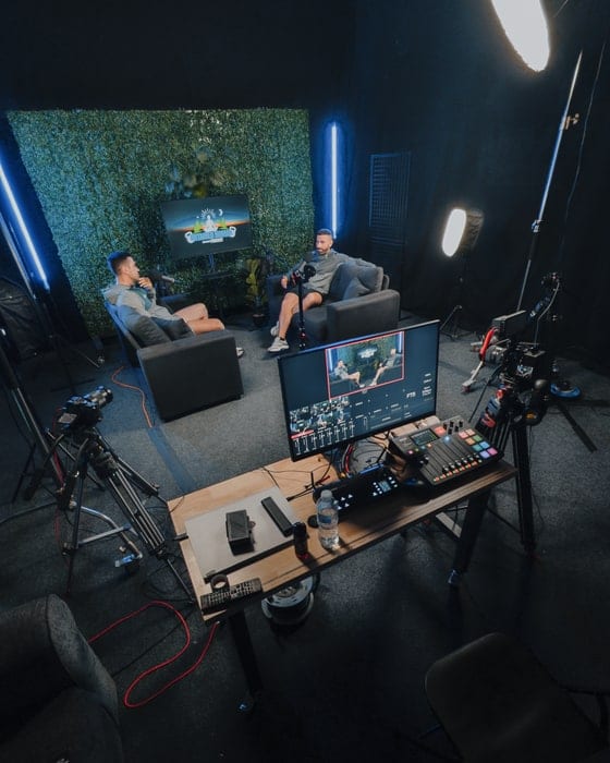 The podcast set seen from above with two people at the desk