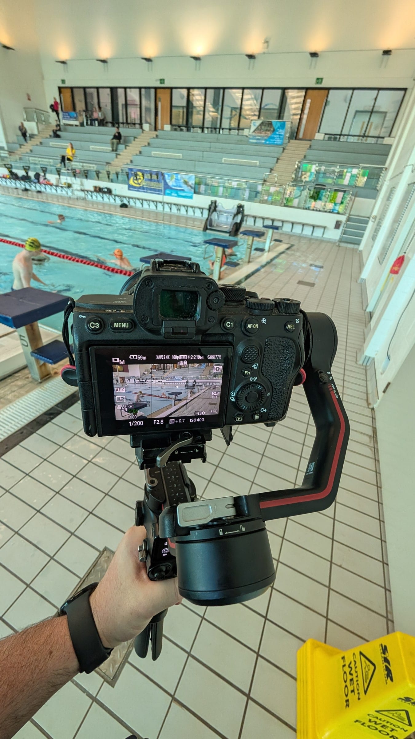 Filming a swimmer from the poolside on a gimbal